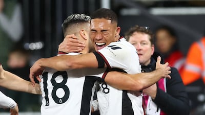 Carlos Vinicius celebrates with Andreas Pereira. Reuters