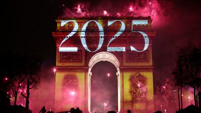 Fireworks explode as "2025" is projected onto the The Arc de Triomphe the New Year's celebrations on the Champs Elysees avenue in Paris, France. Reuters
