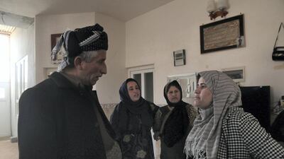 Anti-FGM campaigner Mrs Kurdistan Rasul speaks to Said Abdulwahid, the village elder of Gomasheen. Florian Neuhof for The National