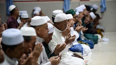 Muslim devotees offer Taraweeh prayers in a mosque during the holy month of Ramadan in Narathiwat, Malaysia. AFP
