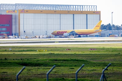 A cargo airplane of the DHL package delivery company stands on the tarmac at Leipzig/Halle Airport. Getty Images