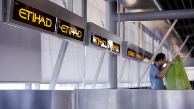 A worker cleans Etihad airlines counters at JFK International Airport in New York, U.S., March 21, 2017. Reuters