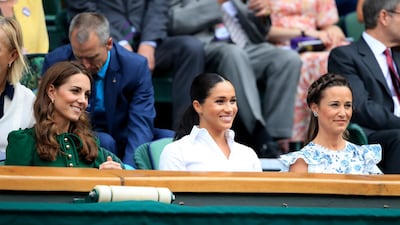 The Duchess of Cambridge and The Duchess of Sussex with Pippa Middleton. Photo: PA