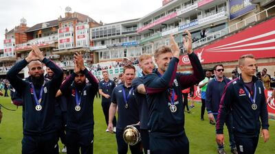 England's Cricket team waves to supporters to celebrate at the Oval in London one day after they won the Cricket World Cup. AP Photo