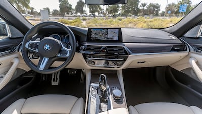The M550i's interior has a sportier feel than the Alpina B5's. Chris Whiteoak / The National