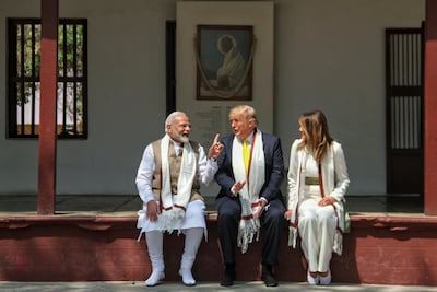 US President Donald Trump and first lady Melania Trump listen to India's Prime Minister Narendra Modi during their visit to Gandhi Ashram in Ahmedabad. AFP / Indian Ministry of External Affairs (MEA)