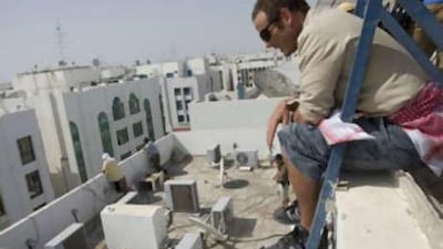 The director of The Kingdom Peter Burg, co-ordinates filming on the set in Abu Dhabi.