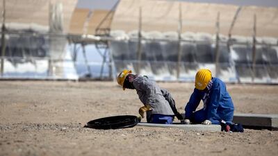 Last minute preparations for the inauguration of the Shams 1 solar power plant. Silvia Razgova / The National
