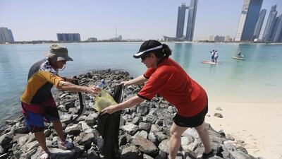 Volunteers from Paddlers for the Planet help clean up the Corniche / Sarah Dea