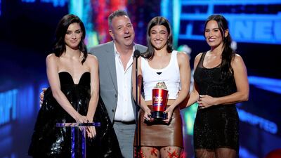 From left to right: Dixie D’Amelio, Marc D'Amelio, Charli D'Amelio and Heidi D'Amelio accept the Best New Unscripted Series award. Getty Images / AFP