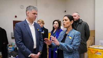 UK Home Secretary Priti Patel with Ukraine's ambassador to the UK, Vadym Prystaiko, during her visit to the Ukrainian Social Club in London. Ms Patel said British staff were being flown to countries bordering Ukraine 'so we can fast-track and speed up applications'. Photo: PA