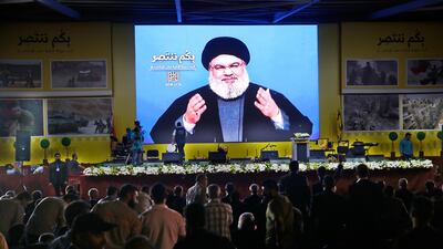 Hassan Nasrallah delivers a broadcast speech through a giant screen in Beirut, Lebanon. AP Photo