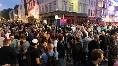 Reveller socialise in the street during the evening in Soho, London, Britain. Pubs, restaurants, places of worship, hairdressers and other businesses have reopened their doors across the UK on 'Super Saturday' after more than three months of lockdown. EPA