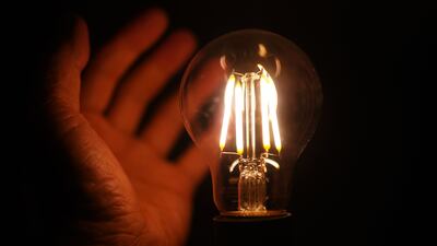 A energy-efficient LED light bulb. The IEA says energy efficiency improvements need to average about 4% a year this decade to align with goals for net-zero emissions by 2050. PA