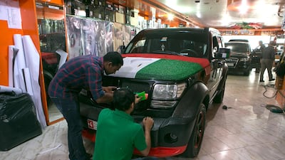 Car owners are not allowed to change a vehicle’s colour, obscure licence plates or cover the windscreen when decorating their cars for National Day. Jeffrey E Biteng / The National