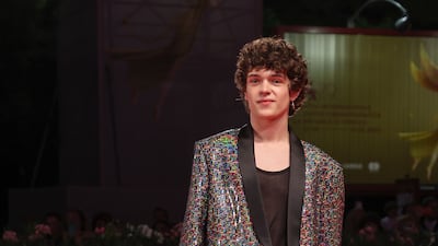 Noah Jupe, in a metallic suit, attends the 'Dreamin' Wild' premiere. AP