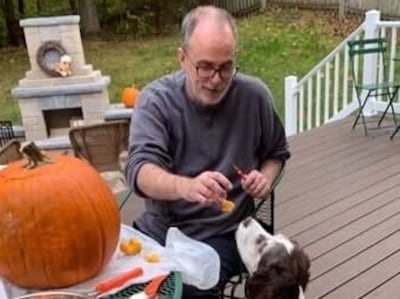 Lisa Anderson was able to bring her pet dog Dandelion, pictured here with her husband, to the US after following entry guidelines. Photo: Supplied