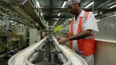 Cup that cheers: a worker packs tea bags at the Lipton factory in Dubai, which is growing as a distribution hub.
