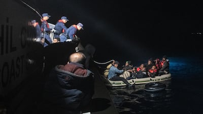 Migrants and refugees are seen on an inflatable boat during a rescue operation by the Turkish Coast Guard on the Aegean sea between Turkish resort town of Bodrum and the Greek island of Kos last week. Getty Images