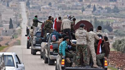 Pro-Syrian government fighters arriving in Syria's northern region of Afrin to take up positions and "participate in defending the territorial unity of Syria and its borders", countering Turkey's offensive on the area / AFP