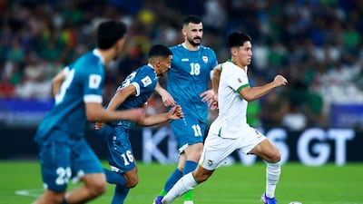 Bolivia's Miguelito evades Iraq's defence. Reuters