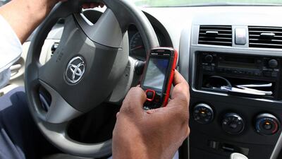 A reader says distracted driving can be a killer on the roads. (Pawan Singh / The National)