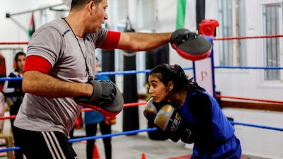 Palestinian Farah Abu Al Qomsan, 15, trains with coach Osama Ayoub at the first women's boxing gym in Gaza City on January 17. Reuters