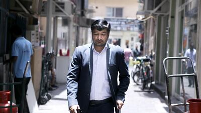 Dubai resident Shahzad Ali has polio and is looking for a better-paid job to help him pay for a new prosthetic. Reem Mohammed / The National
