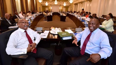 The presidency's office tweeted a photo of Mr Zuma and Mr Ramaphosa laughing together at a Cabinet meeting, in an apparent effort to project an image of close collaboration between the two leaders. GCIS / Reuters