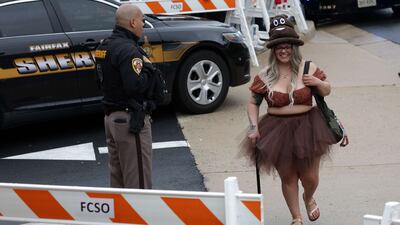 Priscilla Valdes of Waldorf, Maryland, dresses as 'Amber Turd' at the courthouse. Getty Images / AFP