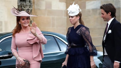 Sarah, Duchess of York, waves as she arrives with Princess Beatrice and Edoardo Mapelli Mozzi ahead of the wedding. Reuters