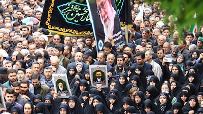 Mourners carrying a portrait of Iran's Supreme leader Ayatollah Ali Khamenei walk in a funeral procession for the late Iranian president Ebrahim Raisi and seven members of his entourage in the northwestern city of Tabriz. AFP