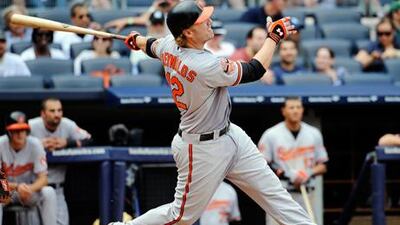 Baltimore Orioles' Mark Reynolds hits a three-run homer against the New York Yankees