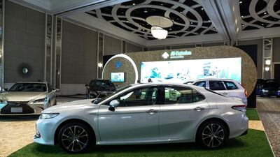 Toyota displayed a range of electrified vehicles, including the hybrid versions of the Camry and Lexus ES. Victor Besa / The National
