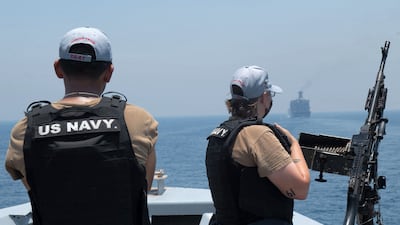 US Navy personnel aboard the guided-missile cruiser USS Monterey looking on while the vessel transits through the Strait of Hormuz, on June 3. (Chelsea Palmer/US NAVY/ AFP).