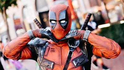 A cosplayer is dressed as Deadpool. AFP