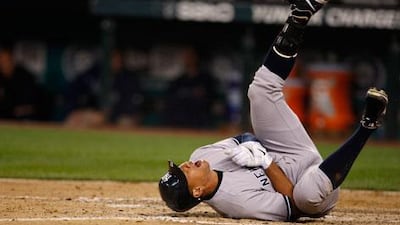 Alex Rodriguez goes down hurt after being struck on the hand by a pitch during New York's defeat to Seattle