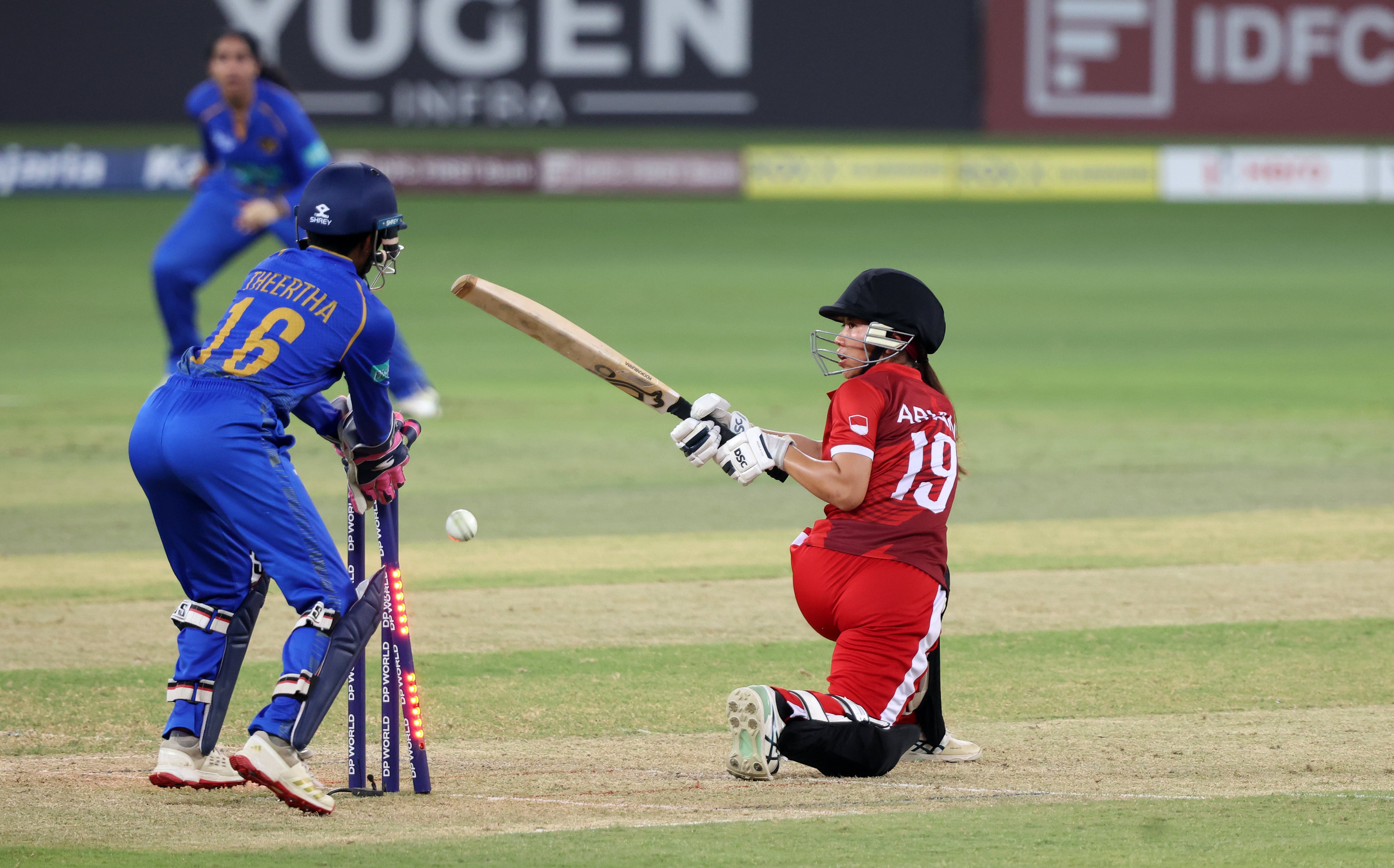Indonesia's Ni Ariani is clean bowled at the Dubai International Stadium