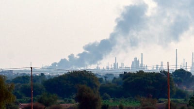 Smoke rises from Al Jeely refinery in the southern part of Bahri. AFP