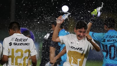 Player of Pumas celebrate after winning the U14 Mina Cup final.