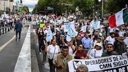 Health workers demand better wages and working conditions, and an end to medicine shortages, at a march in Mexico City. AFP