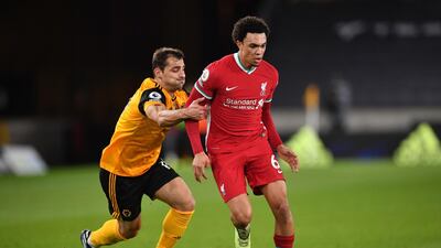 Liverpool right-back Trent Alexander-Arnold under pressure from Wolves' Jonny during the Premier League match at Molineux on March 15. PA