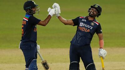 India's Deepak Chahar, right, and Bhuvneshwar Kumar cheer each others after scoring a boundary during the second one day international cricket match between Sri Lanka and India in Colombo, Sri Lanka, Tuesday, July 20, 2021. (AP Photo / Eranga Jayawardena)