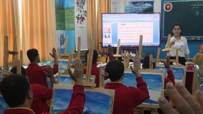Residents paint landscapes during class at Moyu. Anna Zacharias / The National