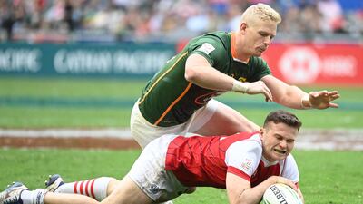 Great Britain captain Robbie Fergusson, bottom, has been busy keeping the peace between the England and Wales players in the squad following their clash at the football World Cup. AFP