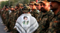 A member of Iraq's Popular Mobilisation Forces displays his support for Iran's assassinated supreme leader Ali Khamenei. AFP