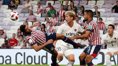 Kashima Antlers' Jung Seung-hyun in action with Guadalajara's Jair Pereira and Marin. Reuters