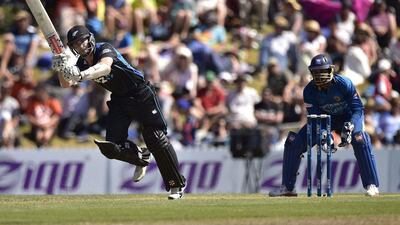 Kane Williamson, left, plays a shot with Sri Lanka's keeper Kumar Sangakkara looking on during the fourth ODI match between New Zealand and Sri Lanka in Nelson. Marty Melville/AFP