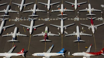 Boeing 737 MAX air planes are seen parked in Seattle. The grounded plane may take its certification flight in October. AFP