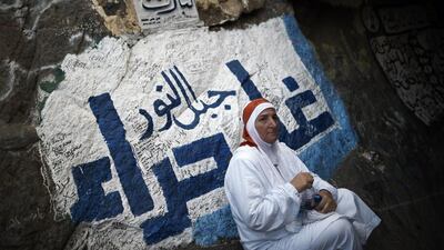 A pilgrim visits the Hira cave on Noor mountain as more than a million Muslims from around the world converge on the holy city of Mecca for the annual Haj pilgrimage. According to tradition, Prophet Mohammed received his first message to preach Islam while praying in the cave. Mohammed Al-Shaikh / AFP
